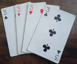 Playing cards of three